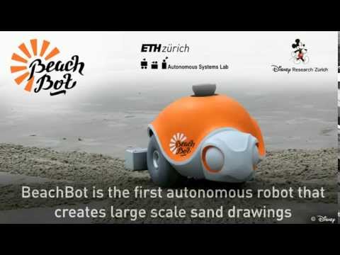 روبوت مميز يرسم كارتون على رمال الشاطئ